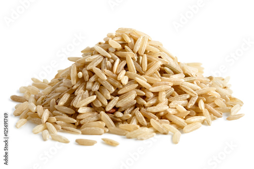 Pile of long grain brown rice isolated on white.