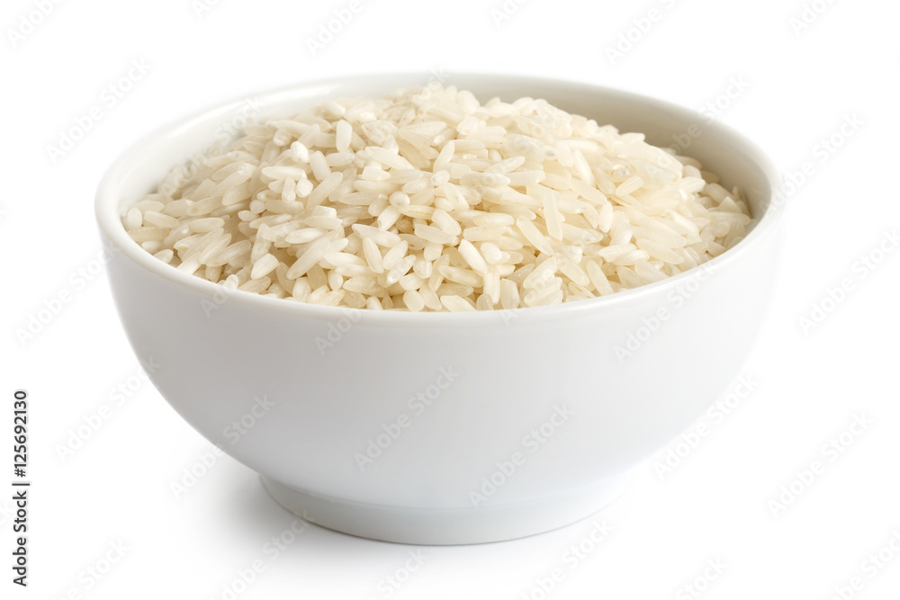 Bowl of long grain white rice isolated on white. Bowl of long grain white rice isolated on white.