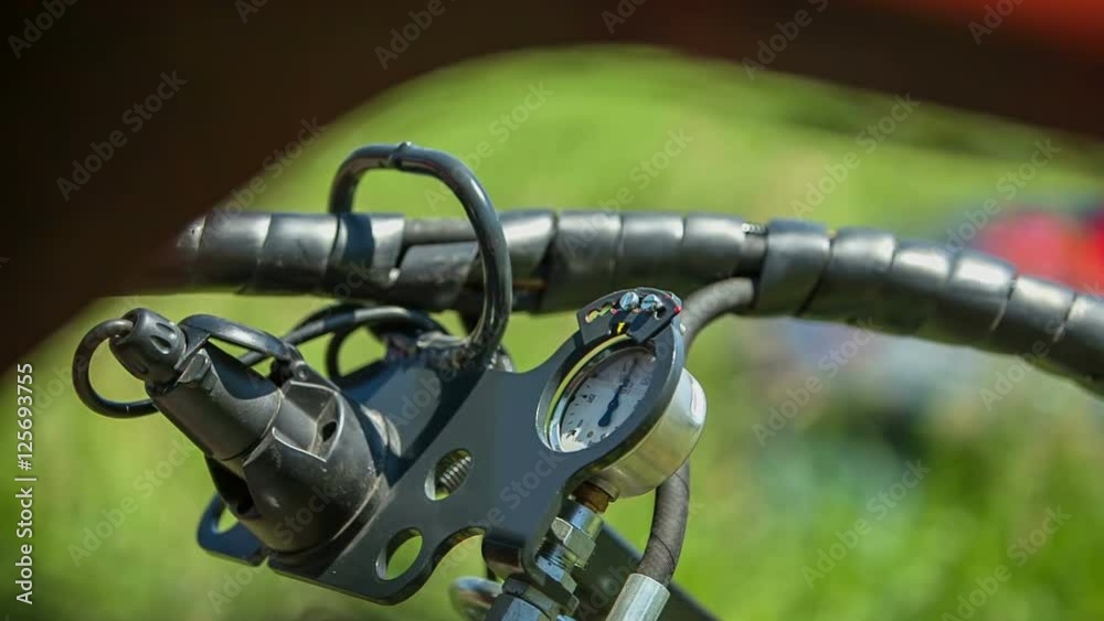 We can see a device that is measuring air pressure. It is standing in the middle of the field of grass. Close-up shot.
We can see a device that is measuring air pressure. It is standing in the middle of the field of grass. Close-up shot.