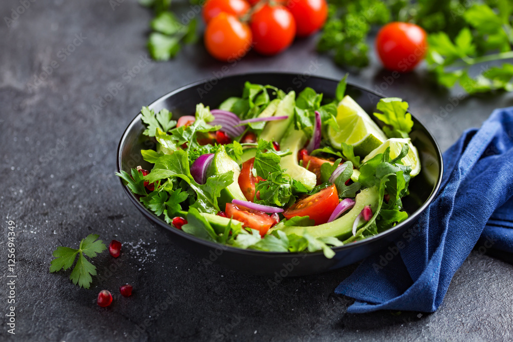 avocado, tomato and arugula salad. Healthy vegan food. avocado, tomato and arugula salad. Healthy vegan food.