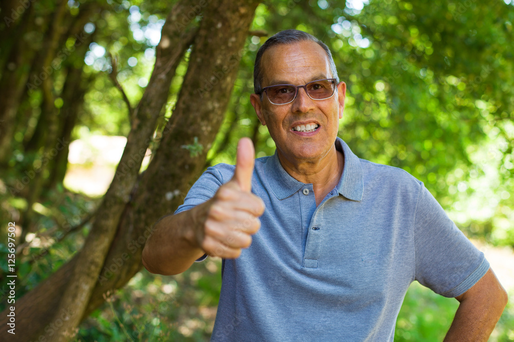 middle aged man doing okay gesture middle aged man doing okay gesture