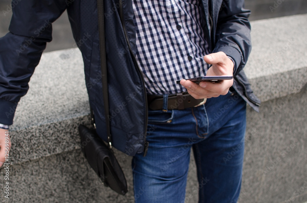 Young man using his phone Young man using his phone
