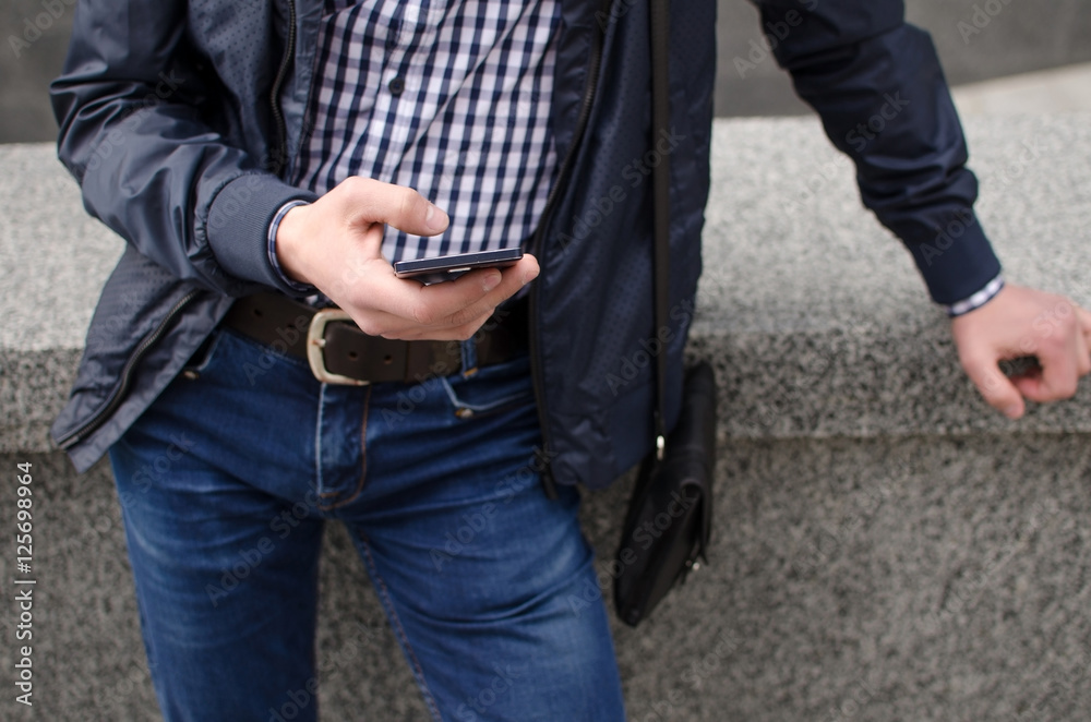 Young man using his phone