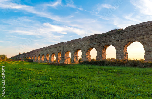 Rome (Italy), The Parco degli Acquedotti at sunset. - Parco degli Acquedotti is an archeological public park in Rome, part of the Appian Way Regional Park, with monumental ruins of roman aqueducts.