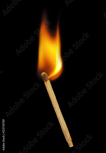 Matchstick on a black background. Soft focus view.