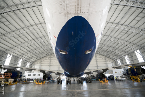big boeing parked in a hangar