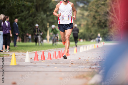 Unrecognizable runner outdoors. Long distance running.