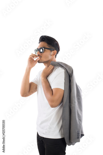 Young Business hipster man smoking a cigarette isolated on white