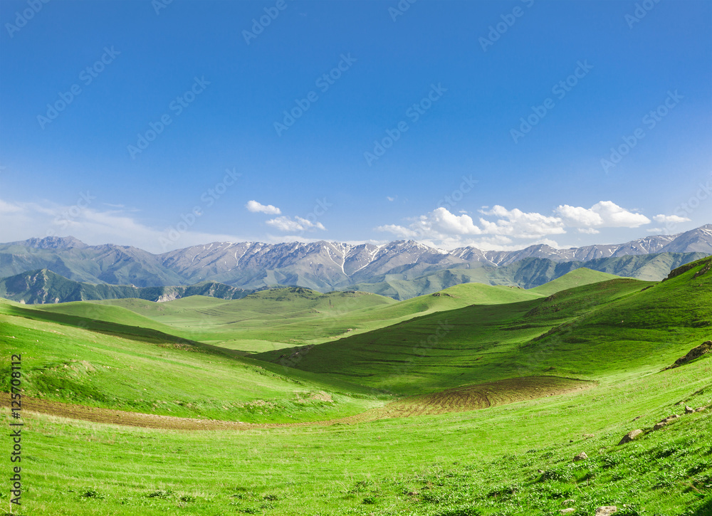 Beautiful landscape with green hills and magnificent cloudy sky. Exploring Armenia