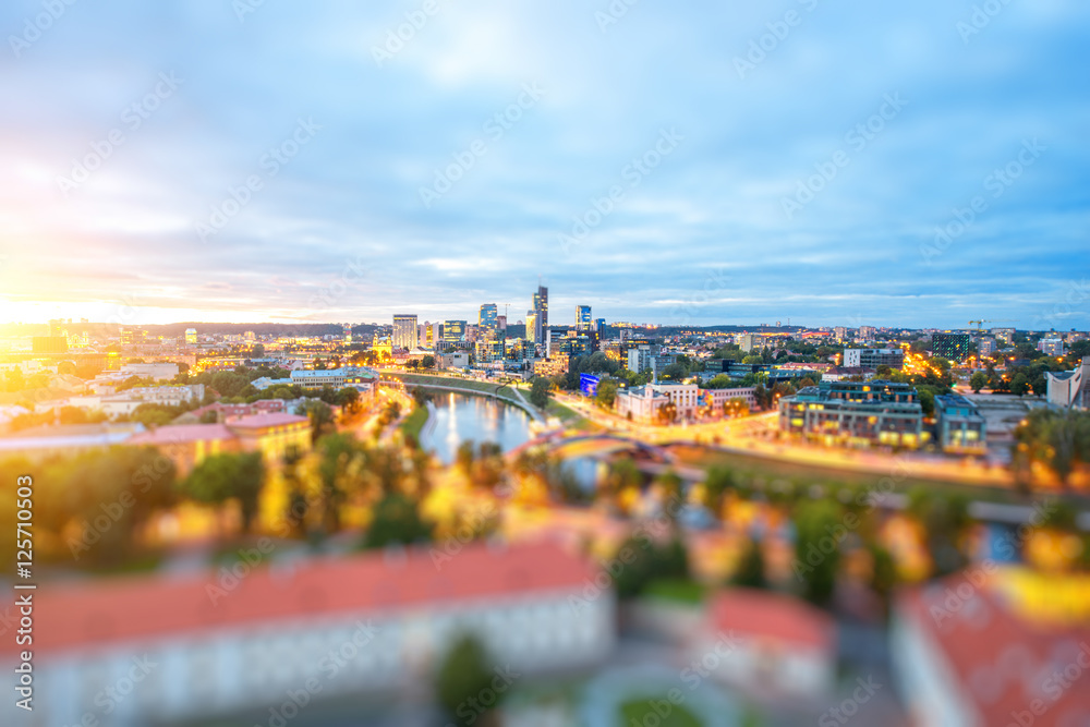 Obraz premium Vilnius cityscape view from the castle hill during the sunset in Lithuania. Wide angle photo with tilt-shift technic