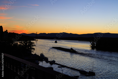 Hudson River at dusk in Hudson with lighthouse and boats © cbell7153
