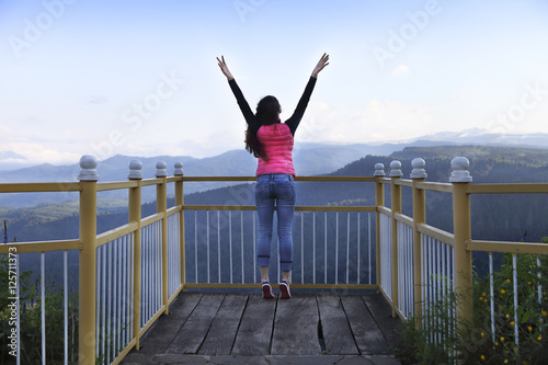 Fotografie, Obraz Young woman standing on viewing platform