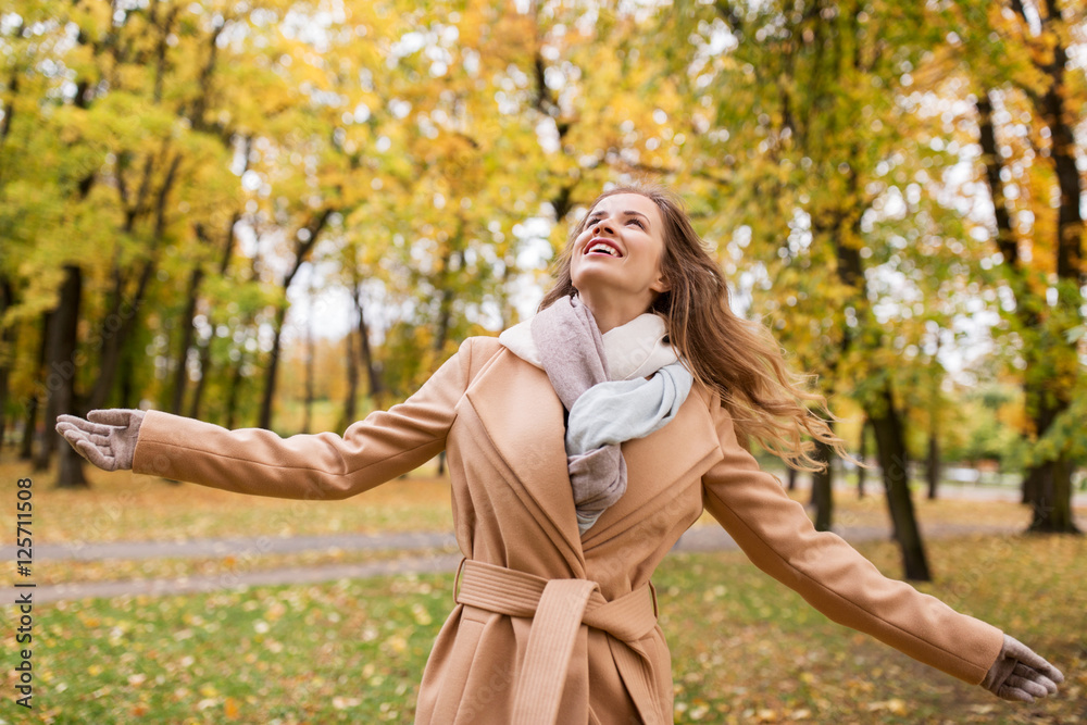 beautiful happy young woman walking in autumn park beautiful happy young woman walking in autumn park