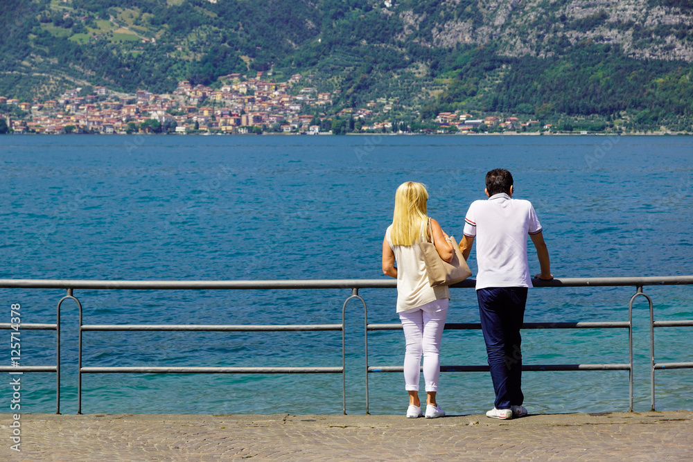 couple watching the view to the horizon in the lake. 