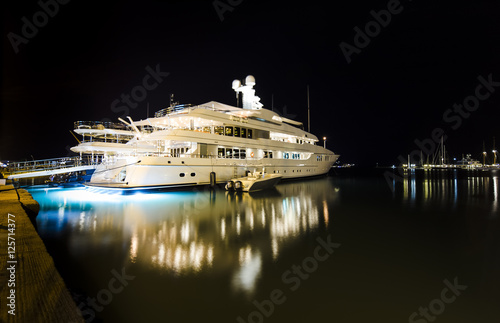 luxurious modern private yacht at the pier at night. Zakynthos, Greece, shallow DOF