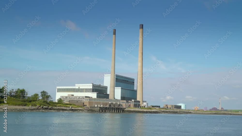 The view of the factory in Killimer Ireland. Killimer is a village in County Clare Ireland in a civil parish of the same name. The view of the factory in Killimer Ireland. Killimer is a village in County Clare Ireland in a civil parish of the same name.