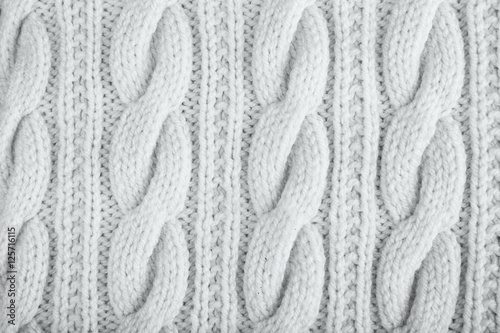 Knitted jersey background with a relief pattern photo