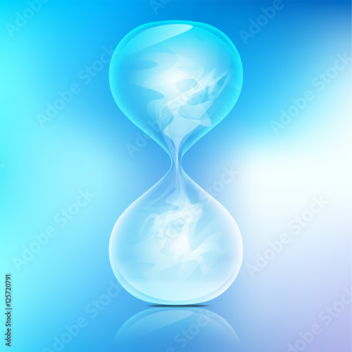True transparent sand hourglass on bule background; Simple and elegant sand-glass timer; abstract science; smoke in sand hourglass refers to emptiness