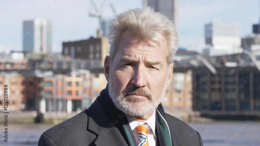 4K Portrait of a senior business man with a serious expression on his face 4K Portrait of a senior business man with a serious expression on his face
