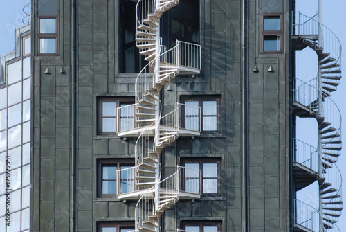 Emergency fire escape staircases on a building exterior. 