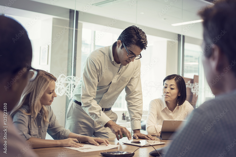 Business people in meeting having interesting discussion Business people in meeting having interesting discussion