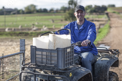 Smiling farmer on a quadbike