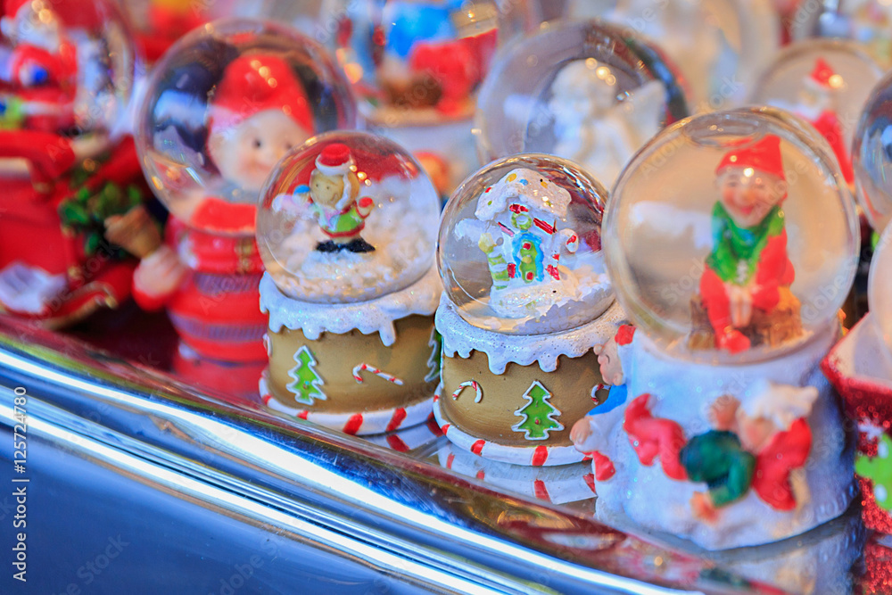 Colorful close up details of christmas fair market. Snowball decorations for sales