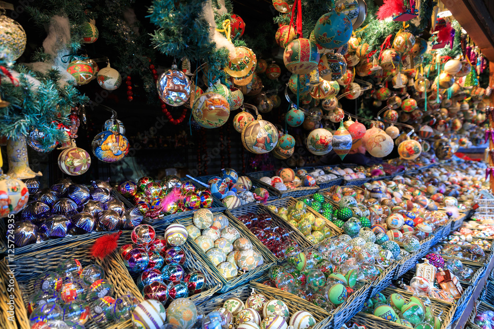 Colorful close up details of christmas fair market. Balls decorations for sales.