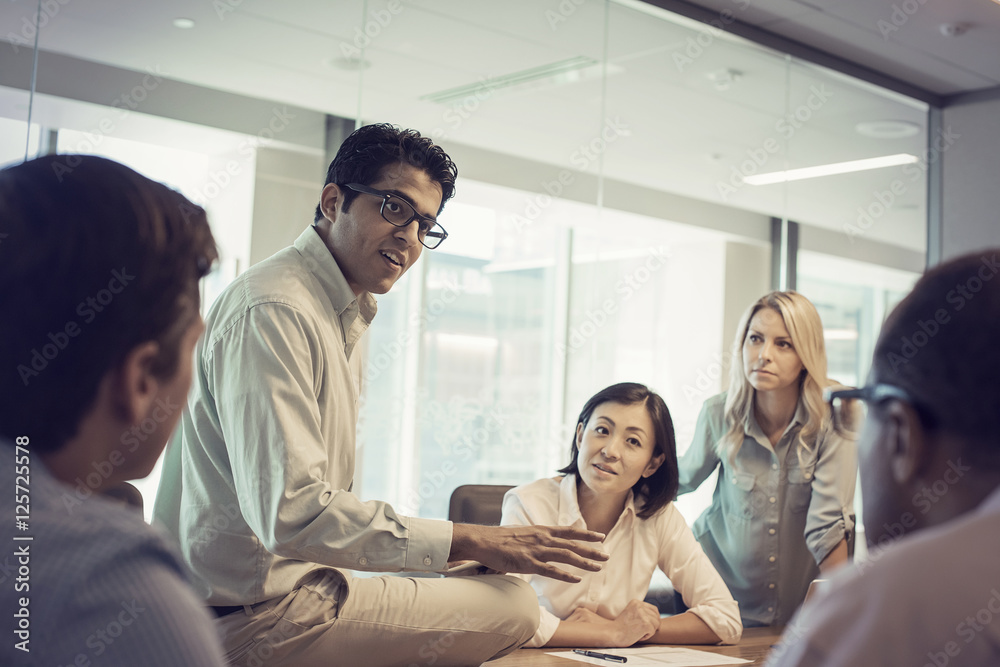 Business people in meeting having interesting discussion Business people in meeting having interesting discussion