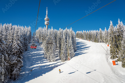 Winter resort with ski lift and ski tracks and the Snejanka tower -  Pamporovo, Bulgaria