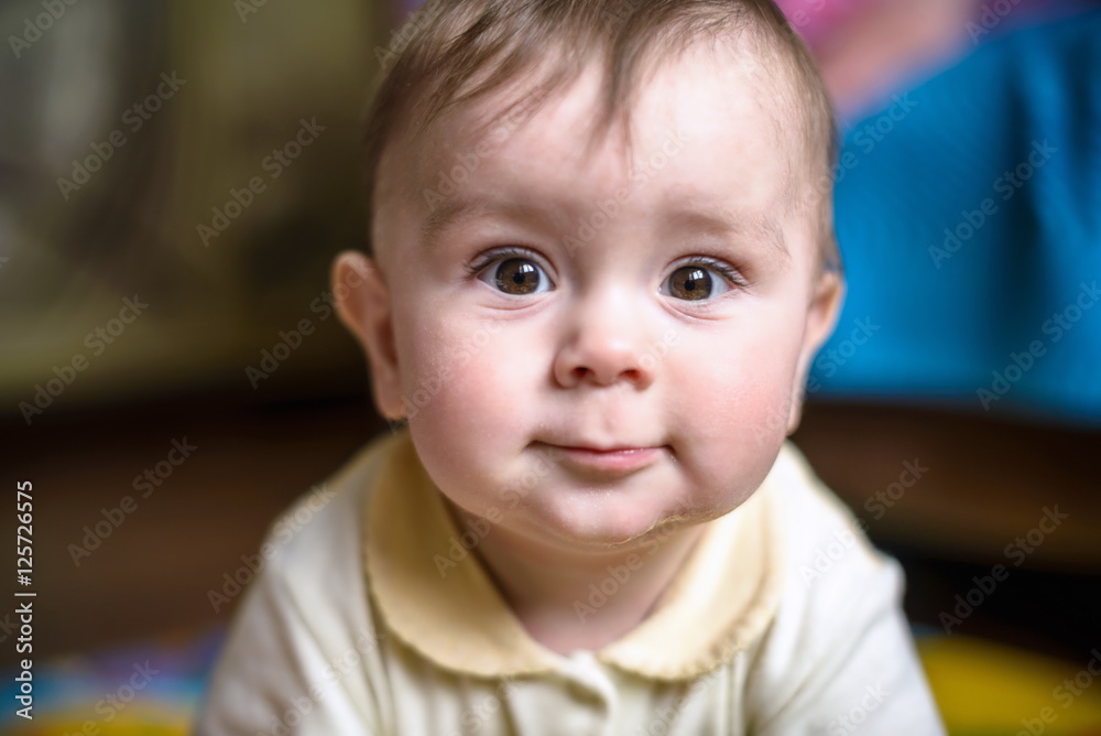 beautiful happy smiling little boy with a big blue eyes and long eyelashes amazing. selective focus on
