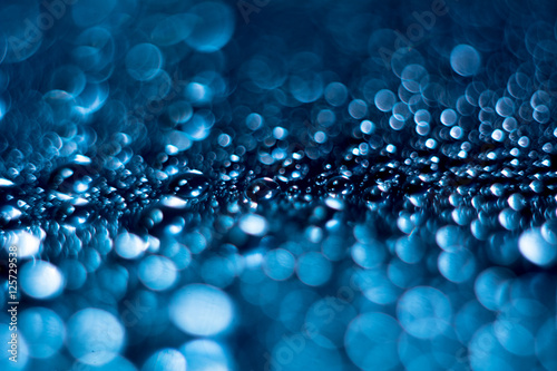 Close-up of water droplets on reflective surface