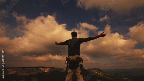 Wallpaper Mural Hiker with backpack relaxing on top of a mountain and enjoying sunrise Torontodigital.ca