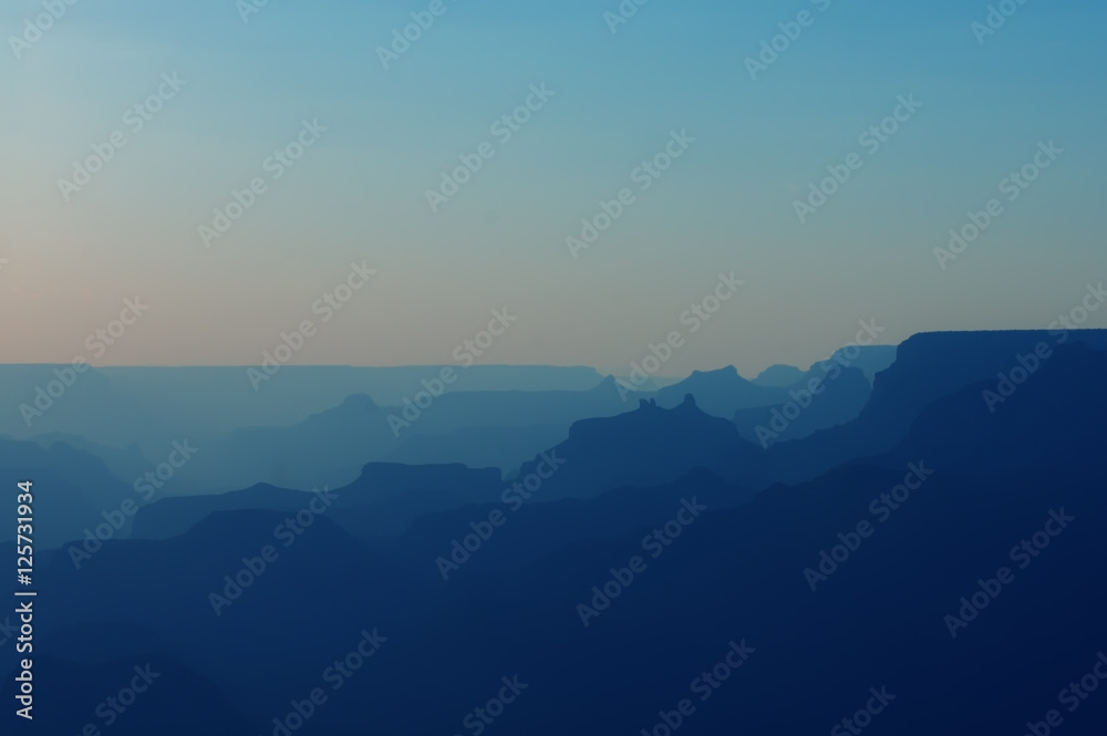Panoramic View of Grand Canyon in blue colors after sunset