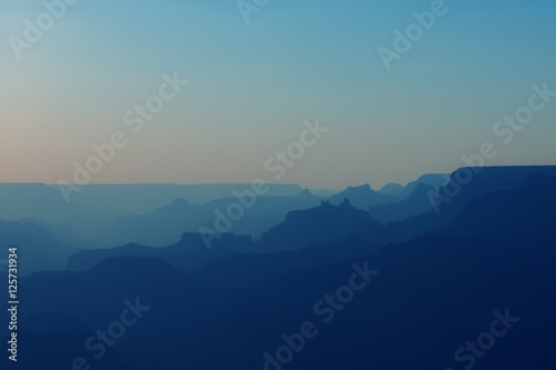 Panoramic View of Grand Canyon in blue colors after sunset