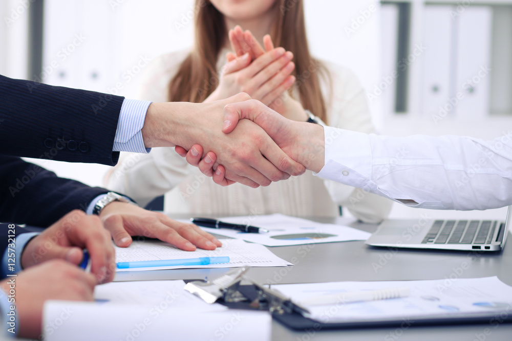 Close up of  two business man shaking hands to each other finishing up the meeting