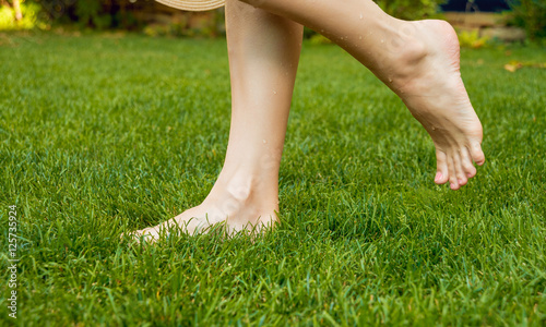 feet on the green grass