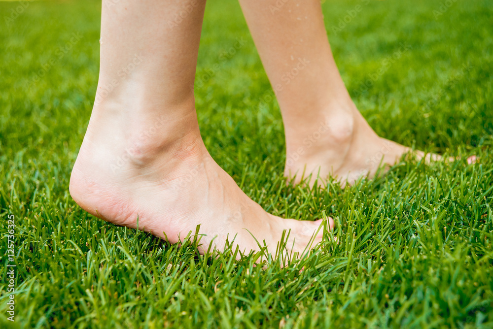 feet on the green grass