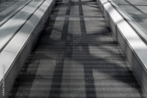 Long walkway of escalator. photo