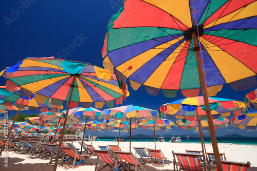 Beach chairs and parasol on Koh Khai island. Phuket, Thailand.