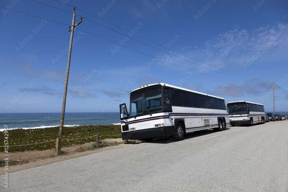 Tour Buses Along Pacific Ocean