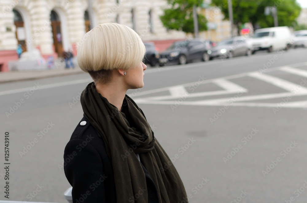 Fototapeta premium Young blonde woman walking in the city