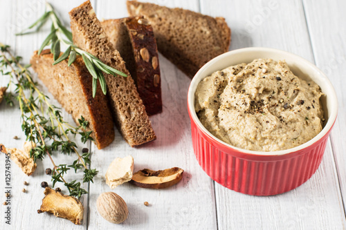 Mushroom pate on a white wooden background, horizontal, selective focus

