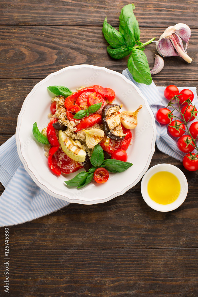 Quinoa salad with grilled vegetables, top view, rustic background Quinoa salad with grilled vegetables, top view, rustic background