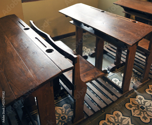 Old desks in the school photo