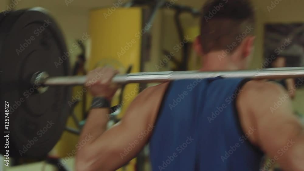 Athletes perform exercises a barbell step in the crossfit training in the gym Athletes perform exercises a barbell step in the crossfit training in the gym