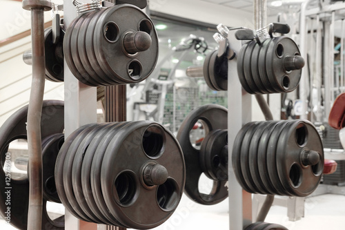 The image of dumbbells on a stand