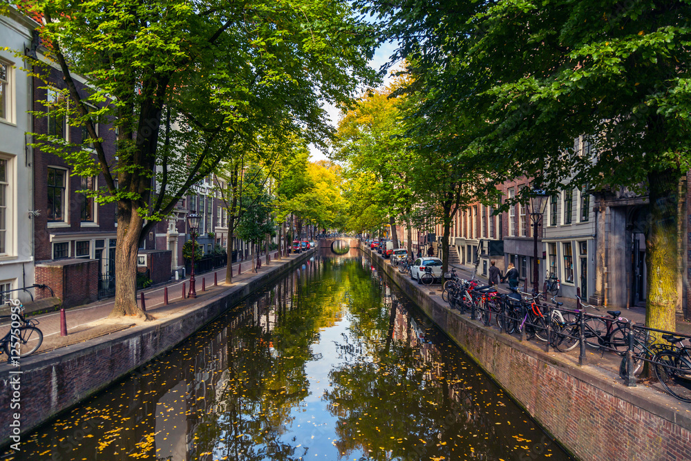 City view of Amsterdam with bridges and bicycles in the Netherlands City view of Amsterdam with bridges and bicycles in the Netherlands