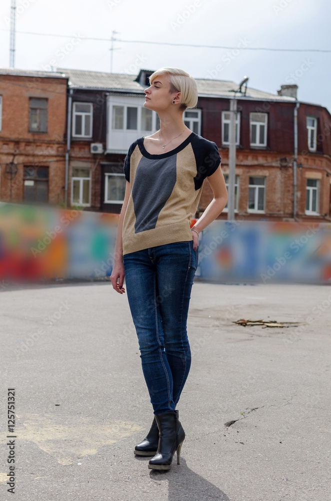 Young blonde girl walking on the city Young blonde girl walking on the city