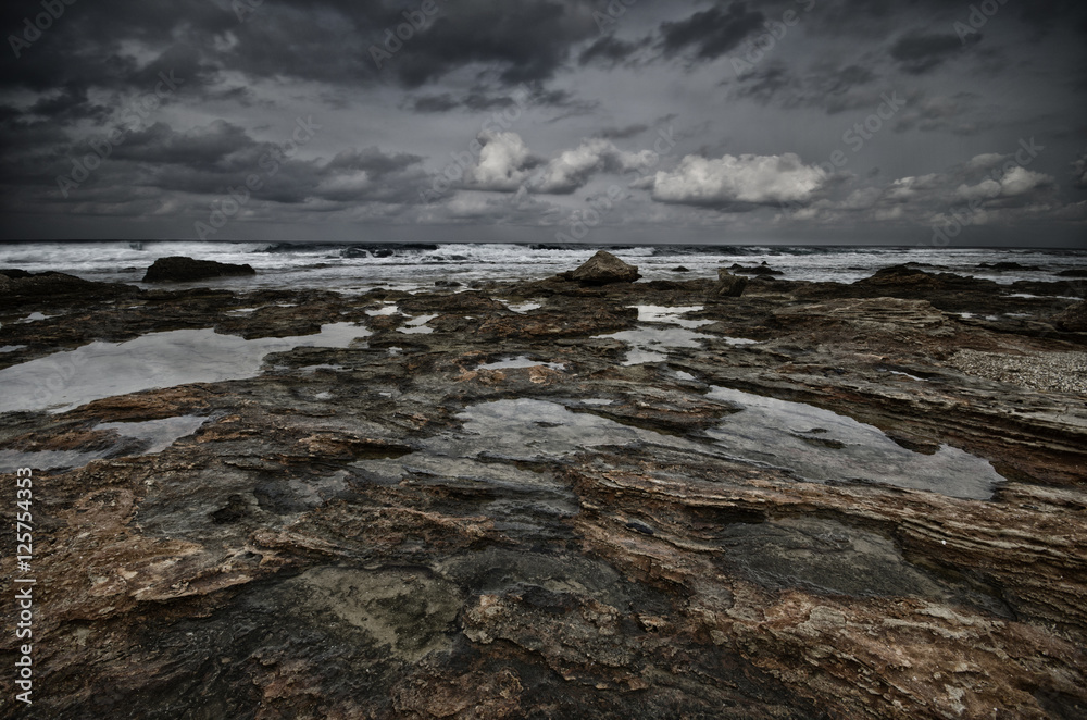 Obraz premium Rocks and sea. Dramatic scene with big waves. Composition of nature, Crete, Greece.